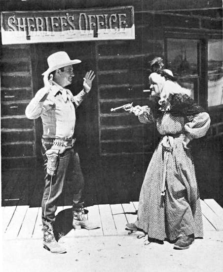 Cactus Kate giving Gene Autry a typical Western greeting